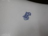 a close up of a plate with a blue design on it