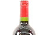 a bottle of wine that is sitting on a table