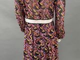 a mannequine wearing a dress with a colorful pattern