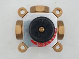 a close up of a brass plated valve on a white surface