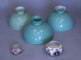 three vases sitting on a table next to each other