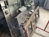 several pieces of metal are stacked on top of each other in a garage