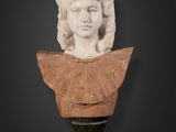 a white marble bust of a woman on a pedestal
