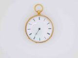 a gold pocket watch with roman numerals on the face