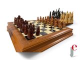 a wooden chess board with a chess set on it