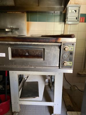 an oven that is sitting in the middle of a kitchen