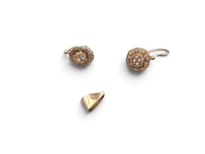 two pairs of gold earrings and a gold earring