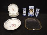 a lot of plates and trays that are on a table
