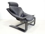 black leather lounge chair with a black leather seat and foot rest