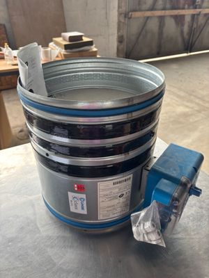 an image of a metal bucket with a blue handle on a table