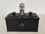 a close up of a light bulb sitting on top of a black box