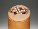 an image of a wooden box with a ring on top of it