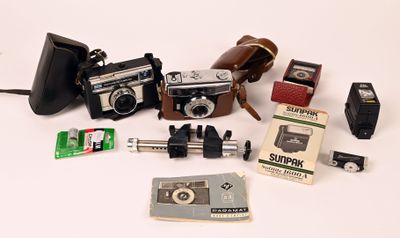 many different types of cameras on a white surface