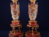 pair of antique vases on stands with red and gold decoration