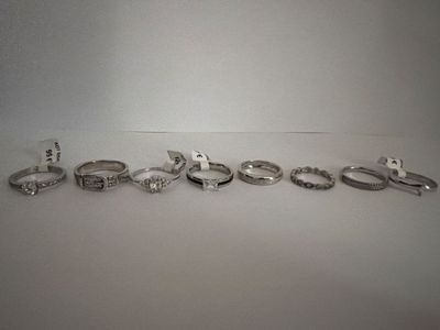 a lot of different rings that are sitting on a table