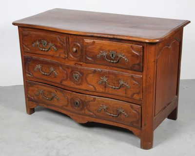 a wooden chest of drawers with many drawers on it