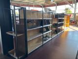 many shelves in the store that have baskets on them