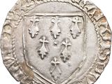 a close up of a coin with a coat of arms on it