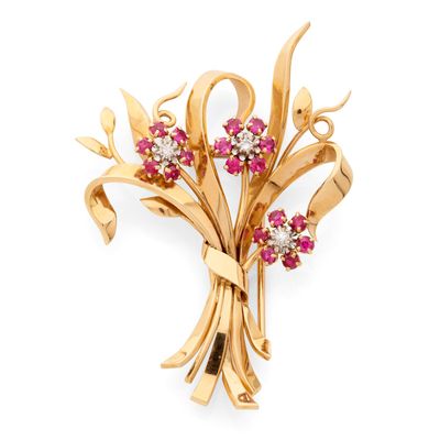 une image représentant une broche en or sertie de pierres roses et blanches