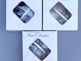 three boxes of three different types of shoes on a blue surface
