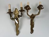 pair of antique brass wall sconces with cherenshes and candles