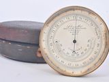 a clock that is sitting on top of a wooden box