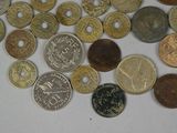 a lot of coins that are on the table