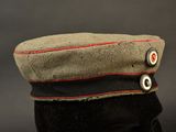 an image of a military hat with buttons on it