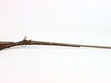 an old rifle with a wooden barrel and a wooden handle