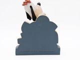 figurine of a man sitting on a cloud with a bird on top of it