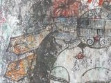 a picture of a painting of a woman with a birdcage on her head