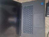 a laptop computer sitting on top of a desk next to a monitor