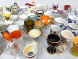 a lot of cups that are sitting on a table