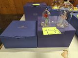 a lot of glass figurines sitting on a table