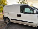 a white van that is parked on the side of the road