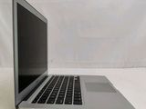 a laptop that is sitting on a white surface