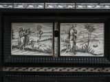 a black and white picture of a door with a painting on it