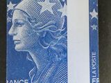 a close up of a stamp with a woman ' s face on it