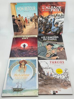 un lot de quatre livres posés sur une table blanche