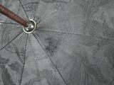 a close up of a black umbrella with a wooden handle