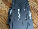 an image of a close up of a video card on a wooden table