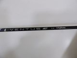 a close up of a golf club that has a logo on it