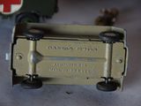 a toy army truck with a red cross on it