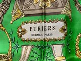 a green and gold scarf with a picture of a horse on it