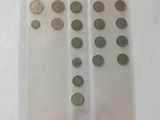 a lot of coins in a plastic container on a table