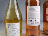 three bottles of wine sitting next to each other on a table