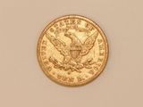 a close up of a gold coin with an eagle on it
