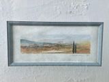 a picture of a painting of a landscape in a picture frame