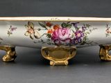 an image of a bowl with flowers painted on it