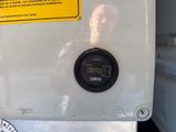 a close up of a clock on the side of a bus